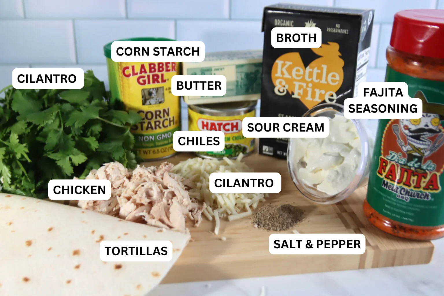 2025-04-26-18.01.36-1536x1024.webp Ingredients for white chicken enchiladas, including tortillas, chicken, Monterey Jack cheese, sour cream, green chiles, broth, butter, cornstarch, cilantro, and fajita seasoning.
